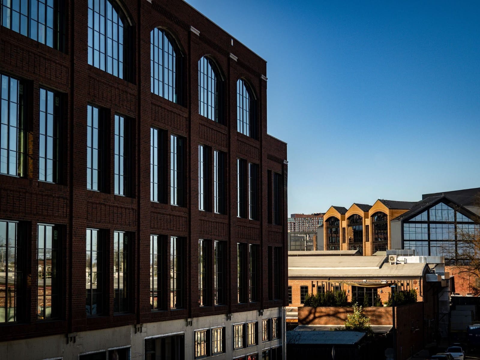 New brick buildings with large loft-style windows, designed to echo the industrial architecture of older structures in Wedgewood-Houston.